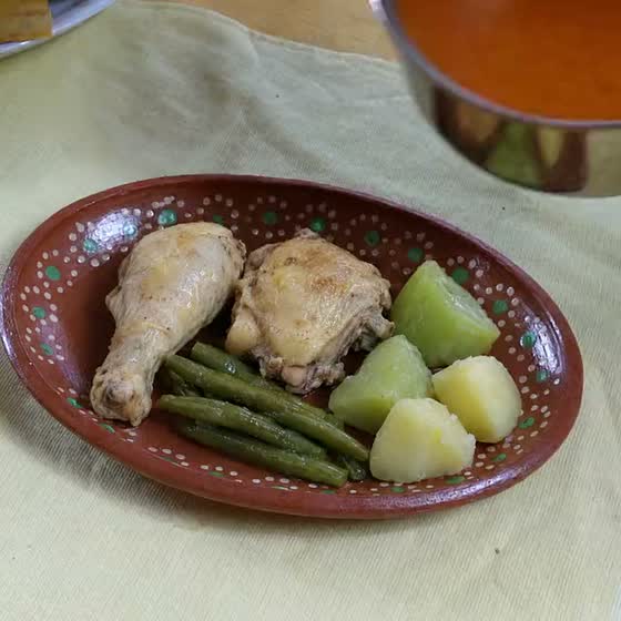 Mole amarillo poured over chicken, green beans, chayote and potato